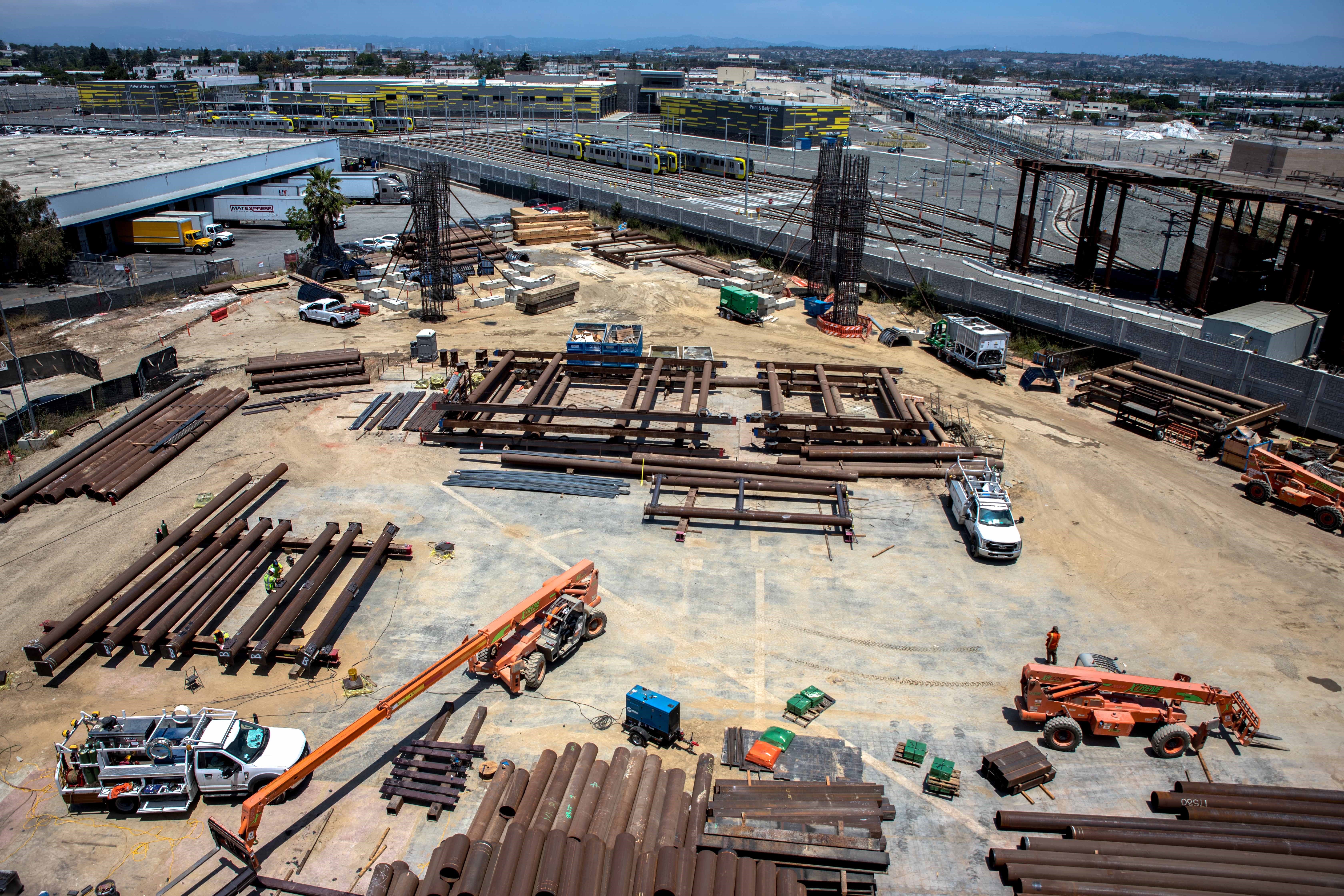 Falsework materials are staged in preparation of guideway construction at the site of the future East-ITF station and the Airport Metro Connector.