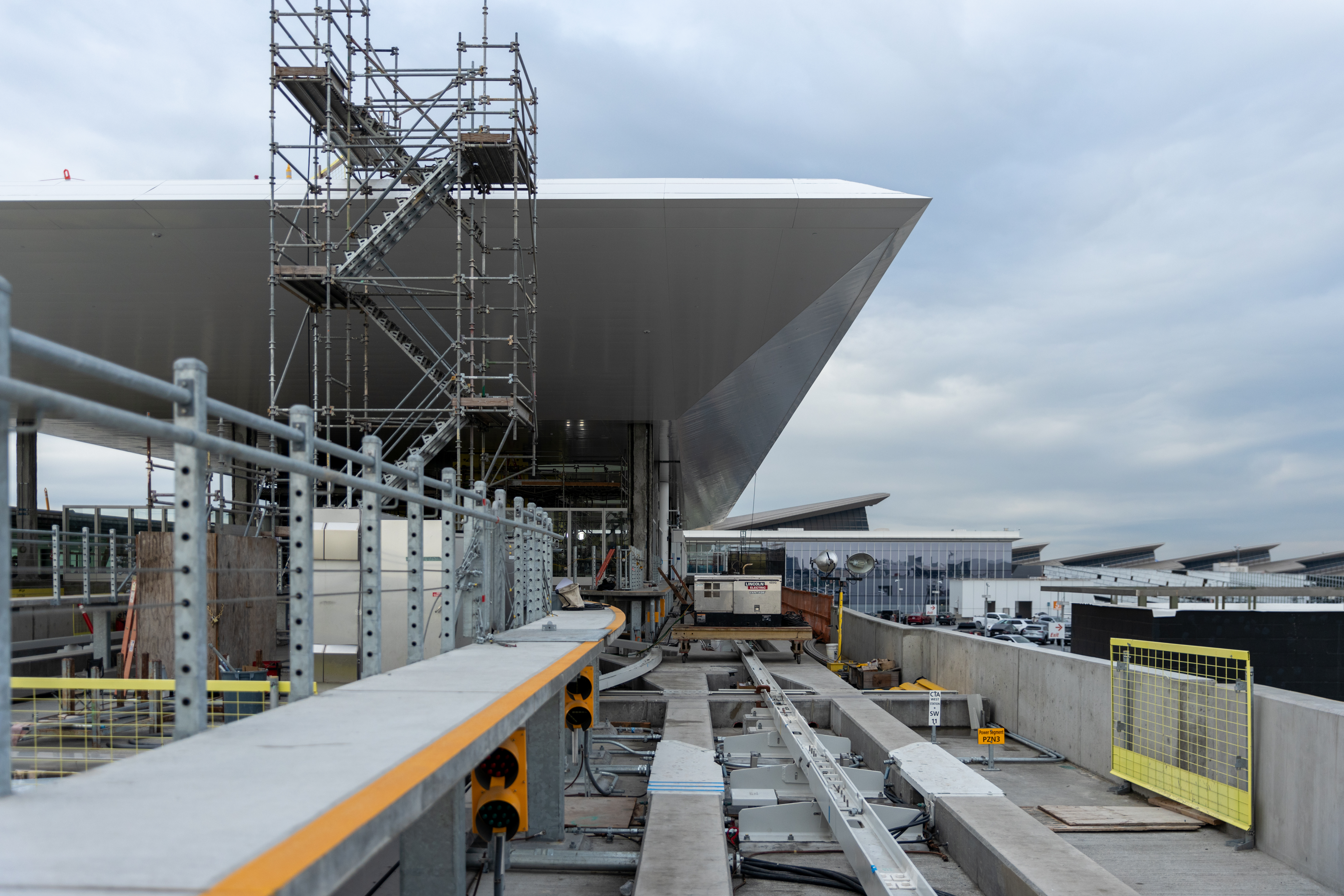 A temporary stair tower provides workers with rooftop access at LAX's People Mover train's West CTA station.